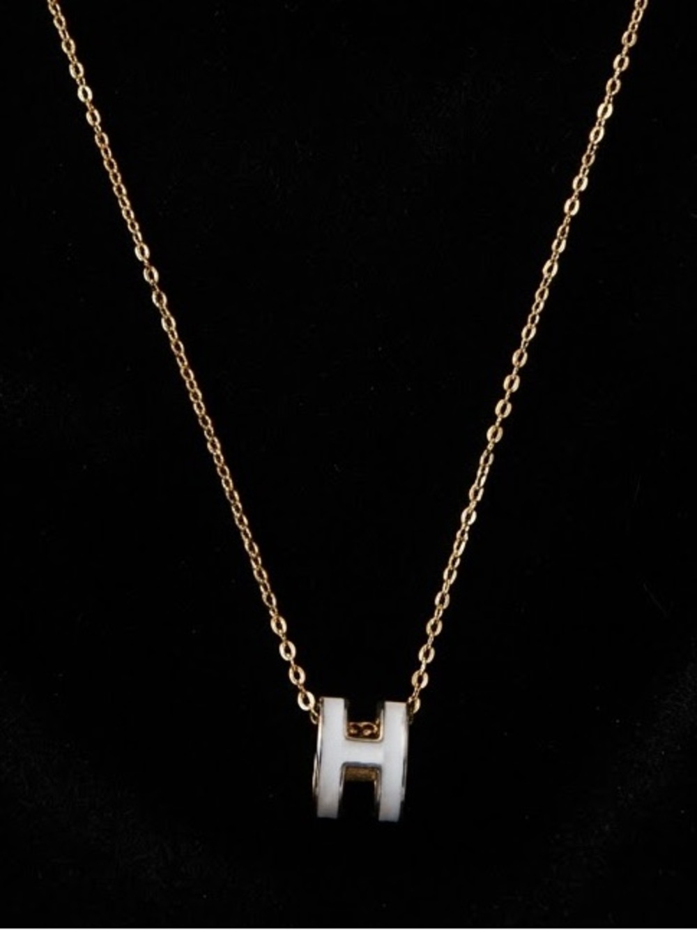 Gold Tone Necklace with White 'H' Initial Pendant